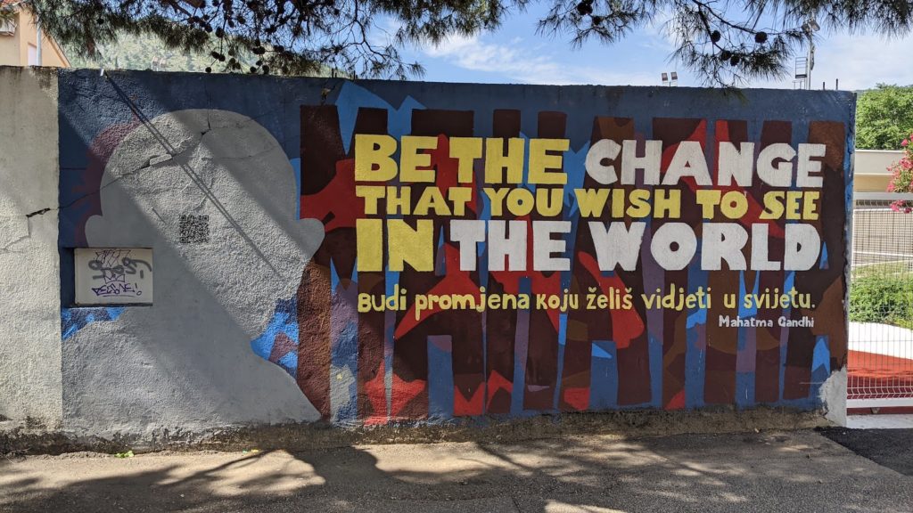 Mural in Mostar with Mahatma Gandhi quote, "Be the change you wish to see in the world"